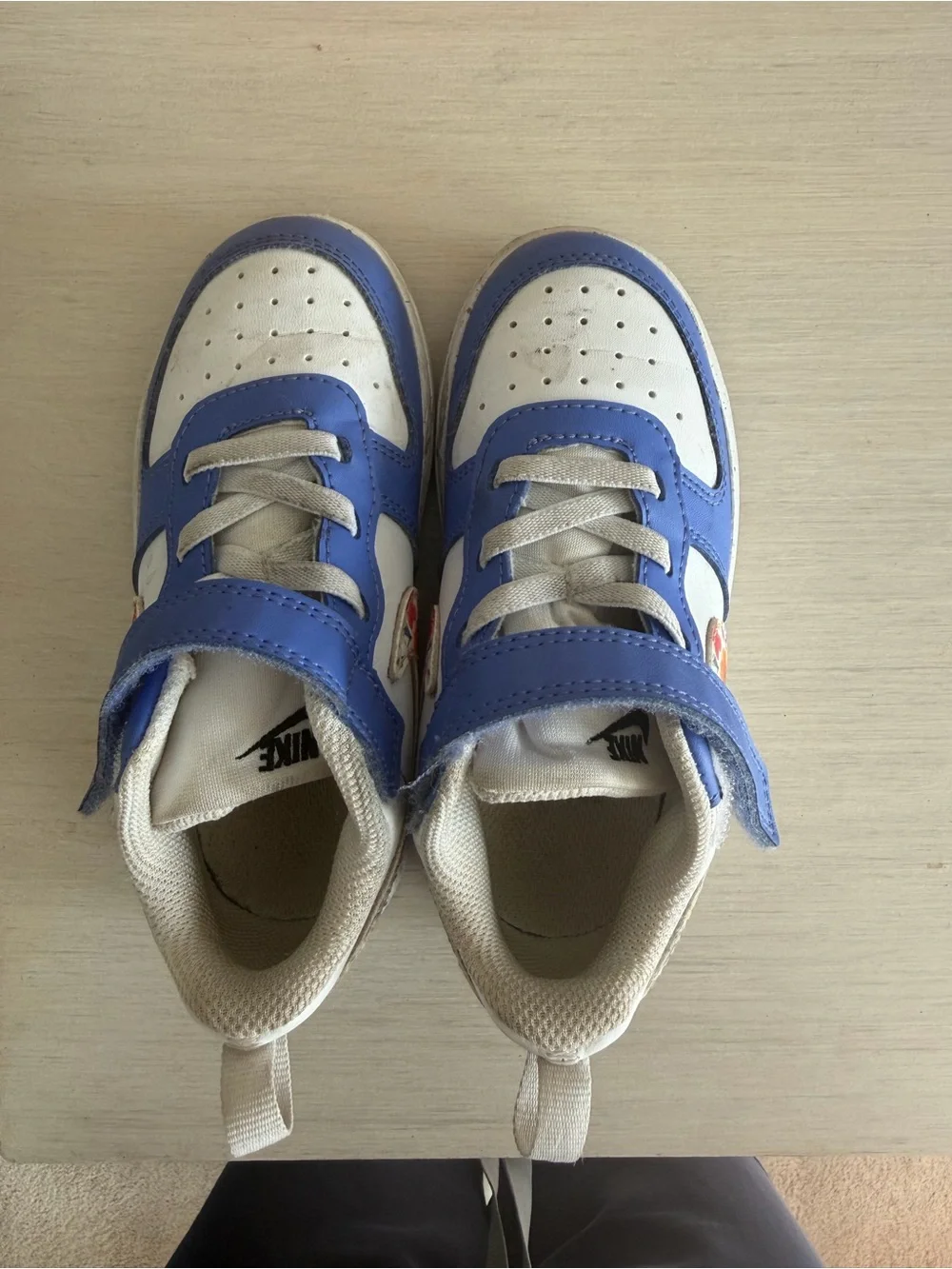 Nike Kids Blue and White Sneakers with Floral Swoosh Accent